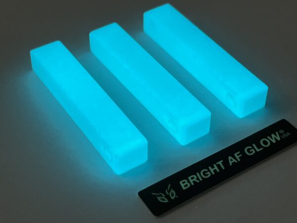 A group of three rectangular blocks with glow in the dark paint.