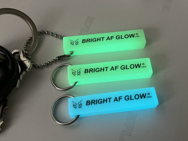 A key chain that says bright af glow.
