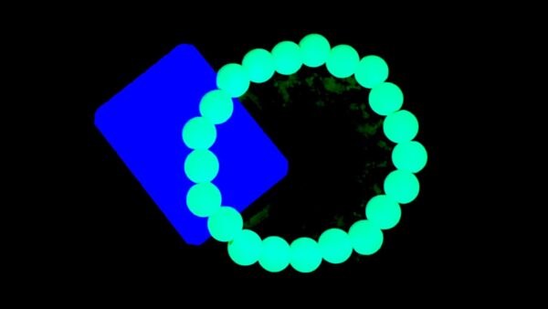 A blue object is shown with a green glow in it.